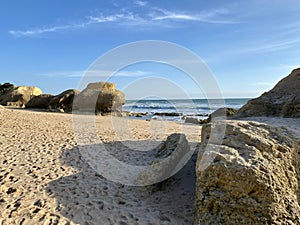 Walking along the sandy beach of Praia Da Gale in Algarve, south of Portugal