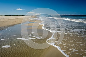 Walking along the Schiermonnikoog coastline on a summer afternoon Netherlands