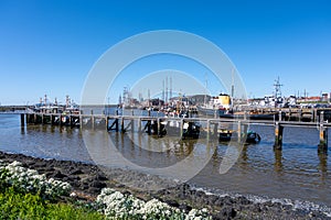 Walking on beach of Harlingen fisherman town on Wadden sea, Friesland, Netherlands at low tide