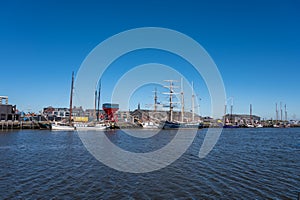 Walking on beach of Harlingen fisherman town on Wadden sea, Friesland, Netherlands at low tide