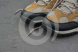 Walking boots on black background