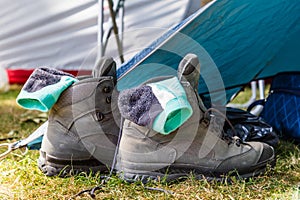 Walking boots beside a tent