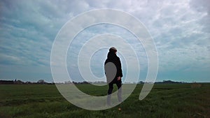 Walking Boy Alone on Grass Trail Slow Motion Side View in rural landscape