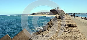 Walking from the Breakwall back to the Lighthouse