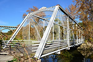 Walking bridge over river in Autumn