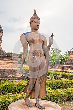 Walking Buddha statue in Sukhothai Historical Park