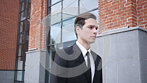 Walking Businessman in Suit, Leaving Office in Slow Motion