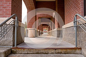 Walking corridor on a university campus leading through and educ