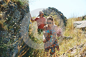 Walking couple between big stones