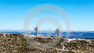 Walking couple in carpathian mountains