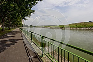 Walking and cycling path by the river photo