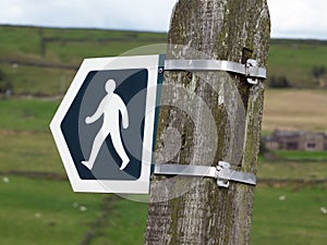 Walking direction sign indicating a path or public footpath