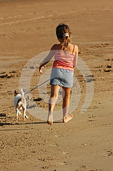 Walking the dog along beach