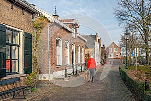 Walking the dog in a historic Dutch village