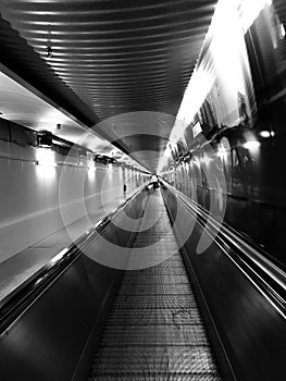 Walking escalators in an airport tunnel unique photo
