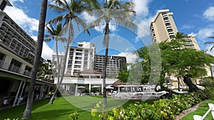 Walking famous Waikiki beach. Warm waves of the Pacific Ocean wash over a tropical Waikiki beach. Turquoise water