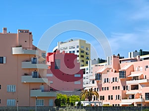 Walking the footpath Passeio do Tejo along Tagus river in Lisbon at the Expo park - with colorful houses