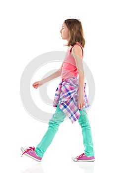 Walking girl, side view.