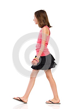 Walking girl, side view.