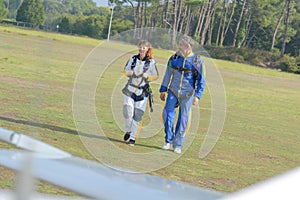 walking going towards plane for parachuting experience