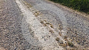 walking on gravel country road,