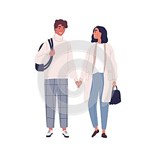 Walking happy modern young people. Couple in love, holding hands and looking at each other. Romantic stylish woman and