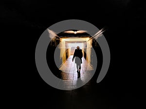 Walking into the light, conceptual image.