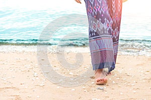 Walking on the maldive each at sunset.