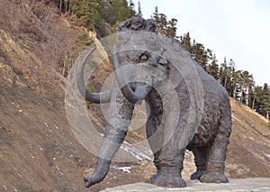 Walking mammoth against precipice