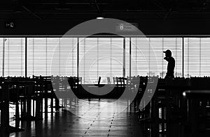 Walking man in airport cafe silhouette