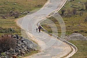 Walking mother & son by road at Bhutan