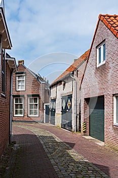 Walking in old Dutch town Zierikzee with old small houses and streets