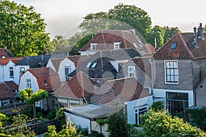 Walking in old Dutch town Zierikzee with old small houses and streets