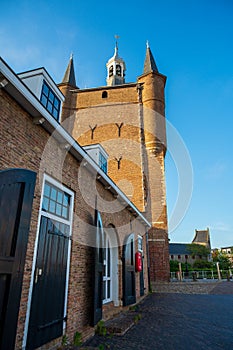 Walking in old Dutch town Zierikzee with old small houses and streets