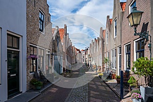 Walking in old Dutch town Zierikzee with old small houses and streets