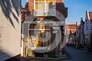 Walking in old Dutch town Zierikzee with old small houses and streets