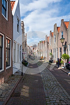 Walking in old Dutch town Zierikzee with old small houses and streets