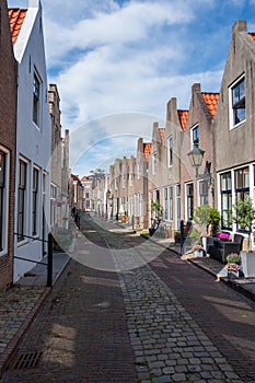 Walking in old Dutch town Zierikzee with old small houses and streets