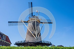 Walking in old Dutch town Zierikzee with old windmill, small houses and streets