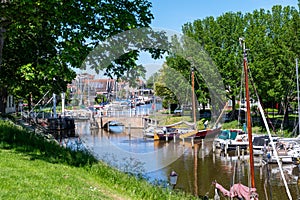 Walking on old streets of Harlingen fisherman town on Wadden sea, Friesland, Netherlands