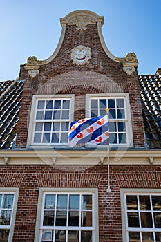 Walking on old streets of Harlingen fisherman town on Wadden sea, Friesland, Netherlands