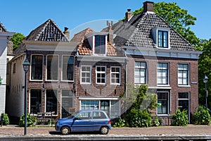 Walking on old streets of Harlingen fisherman town on Wadden sea, Friesland, Netherlands