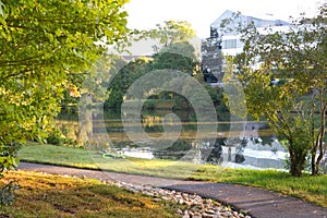 Walking Path around Lake with Glass Building