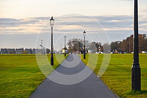 Walking path with lampposts on Blackheath in London, England