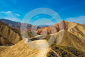 Walking path through Rainbow mountains in Zhangye Danxia National Geopark, Gansu Province, China