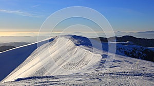 Snow covered mountain ridge