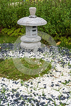 Walking path and zen-like white pagoda gravel landscape in Japanese garden