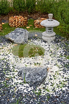 Walking path and zen-like white pagoda gravel landscape in Japanese garden