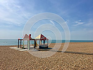 Pastel beach huts on a British beach