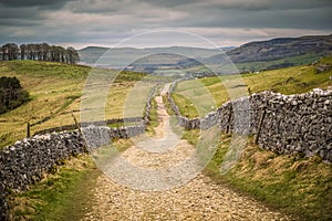 Walking on the Pennine Way and Ribble Way below Pen-y-Ghent in Horton in ribblesdale